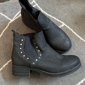 Black faux shade boots with metal circle detail, worn once